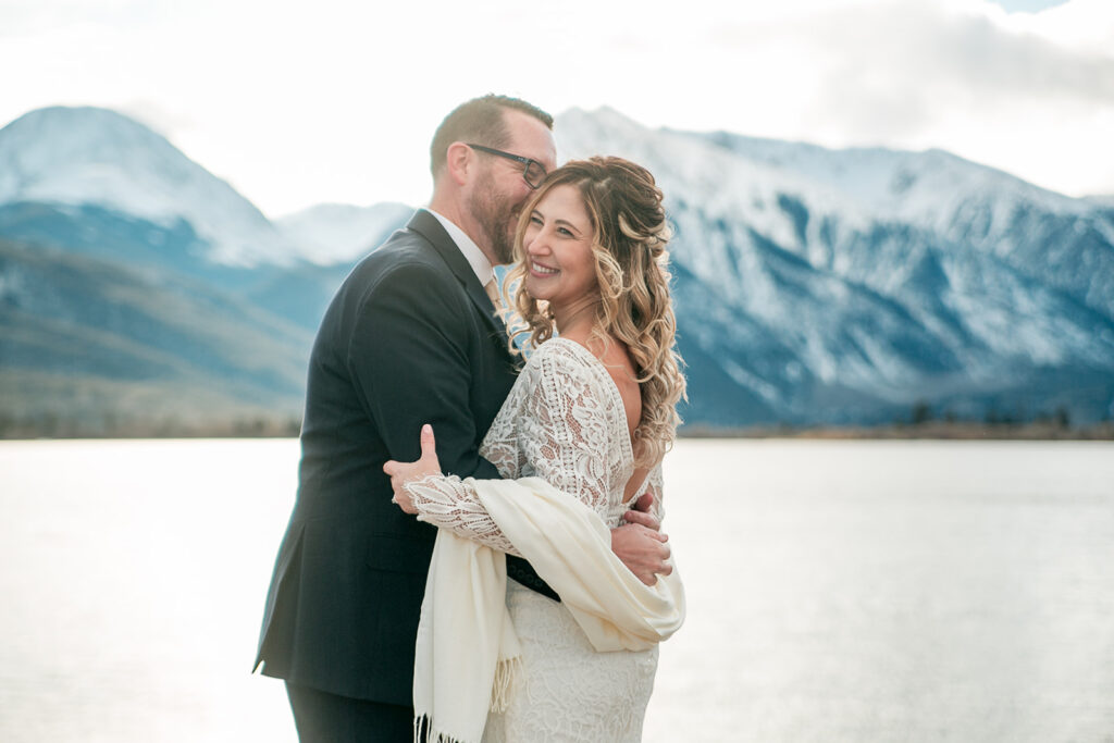 cute and cuddly bride and groom with mountain views at buena vista