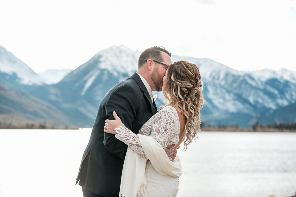 cute and cuddly bride and groom with mountain views at buena vista