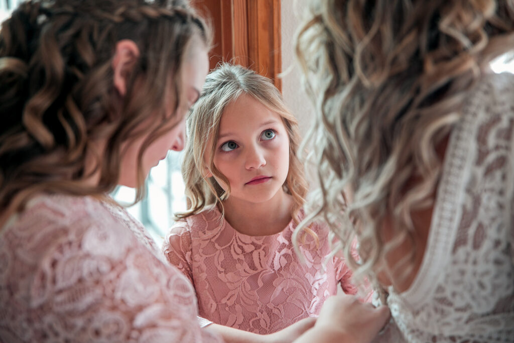 daughters helping bride get ready