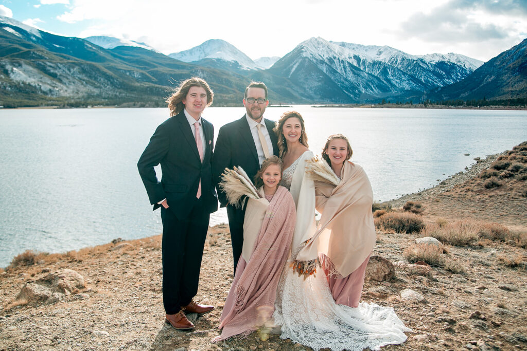 elopement couple posing with their three children during their colorado elopement day