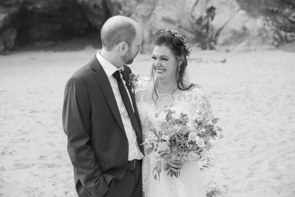 emotional bride and groom during their elopement ceremony at hug point, oregon coast