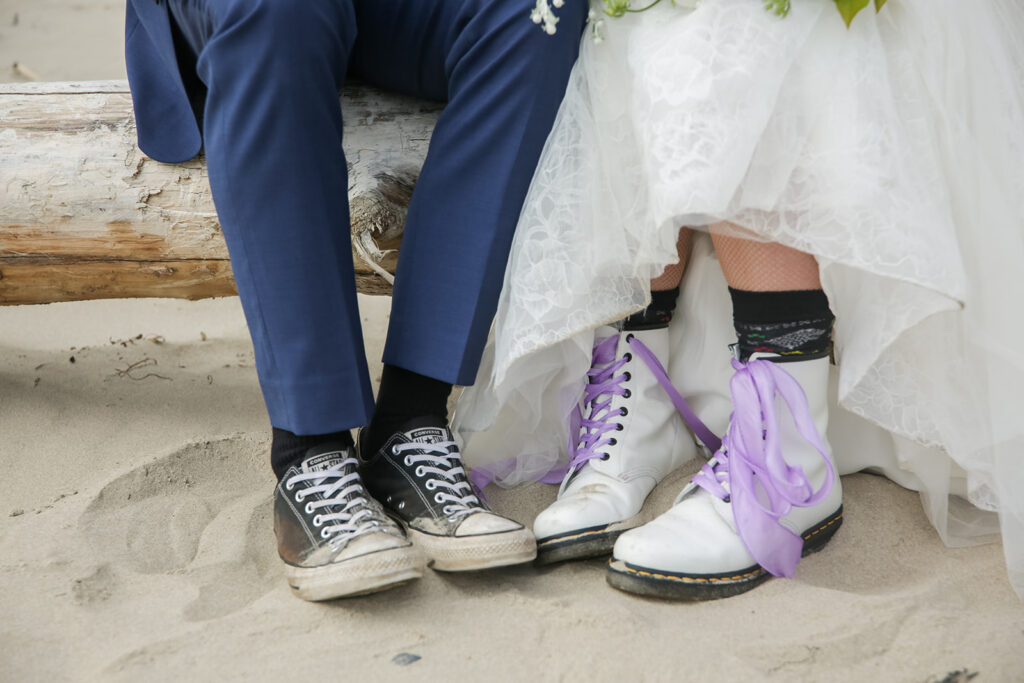 close up of bride and groom's casual footwear for their adventure elopement at oregon coast