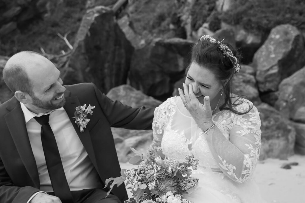 bride and groom laughing together