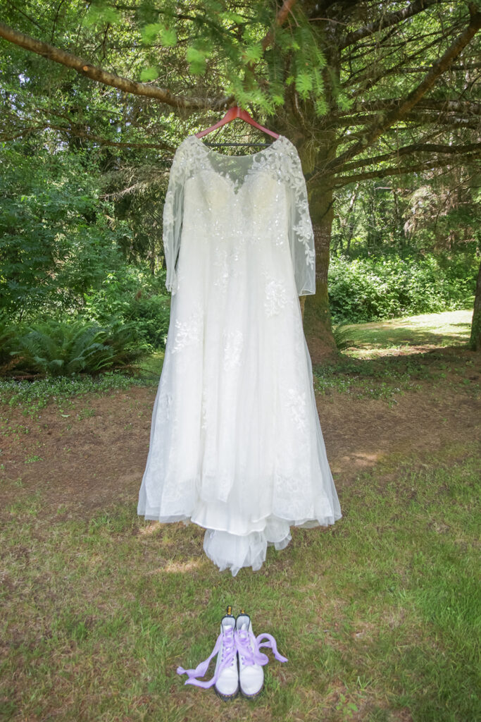 wedding dress hanging from a tree